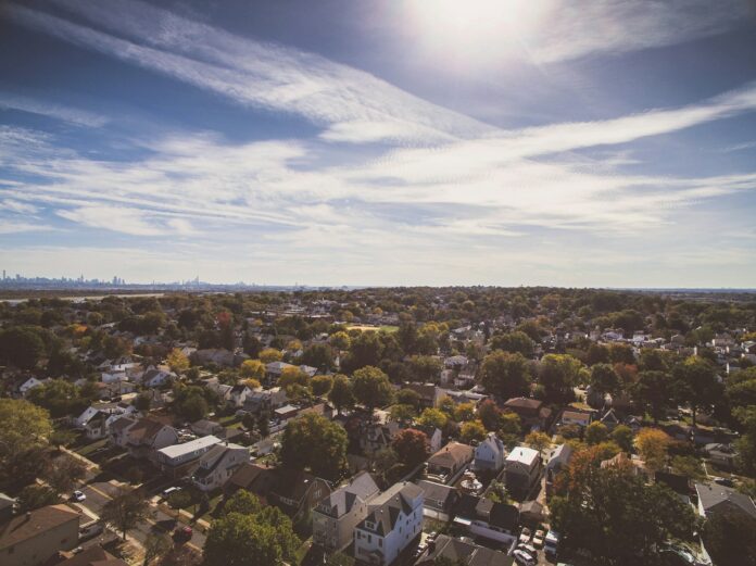 Photo by Matt Donders aerial photography of houses near trees