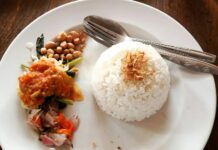 체중 증가 예방을 위한 식습관 개선 a white plate topped with rice and beans