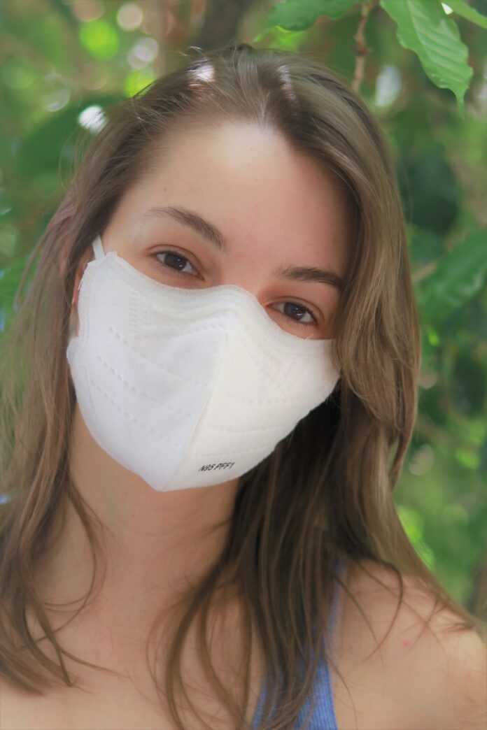 woman with white face mask