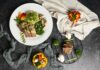 변화하는 식단 트렌드, 내 일상에 건강하게 녹이려면 a white plate topped with meat and veggies